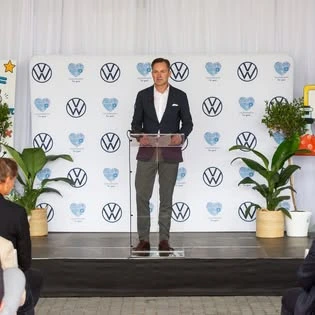 A speaker at the lectern during a corporate event coordinated by Events Crafted